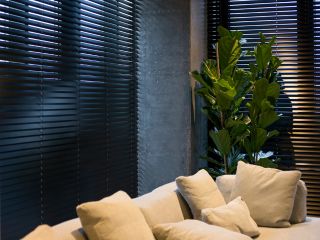 Faux wood blinds installed in an elegant living room
